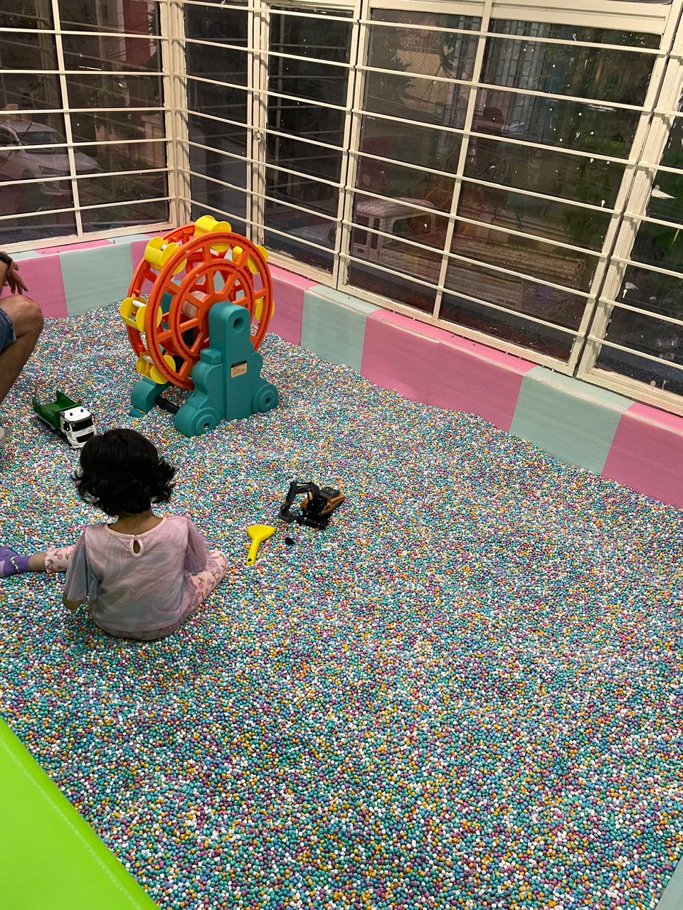 Ball pit with ride-on ferris wheel toy at KOJO Patia
