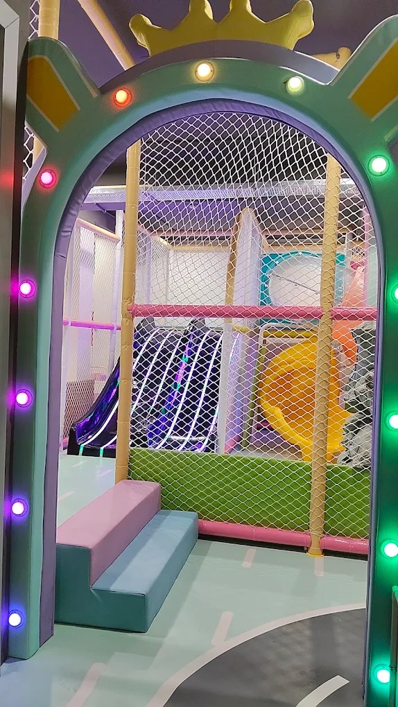 Light-up crown archway entrance to the play zone at KOJO Shaheed Nagar